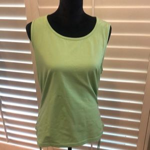 St. John Sport sleeveless top with adjustable draw string sides.